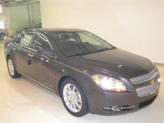 Chevrolet Malibu 2010 Kia SX Sedan